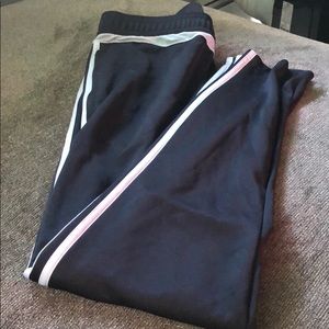 Adidas track pants in gray with white stripe